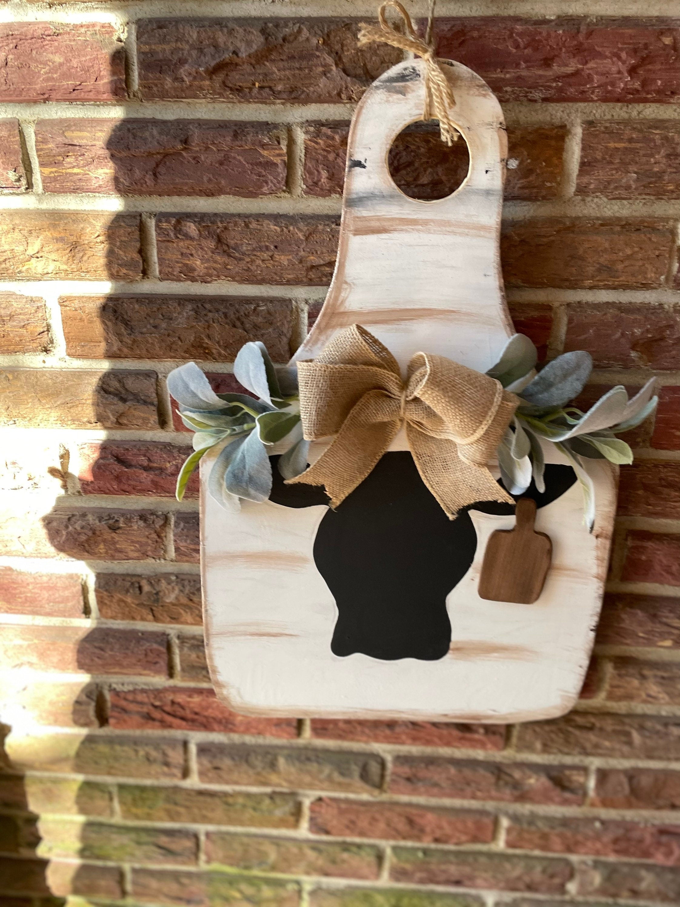 Cow door hanger with greenery