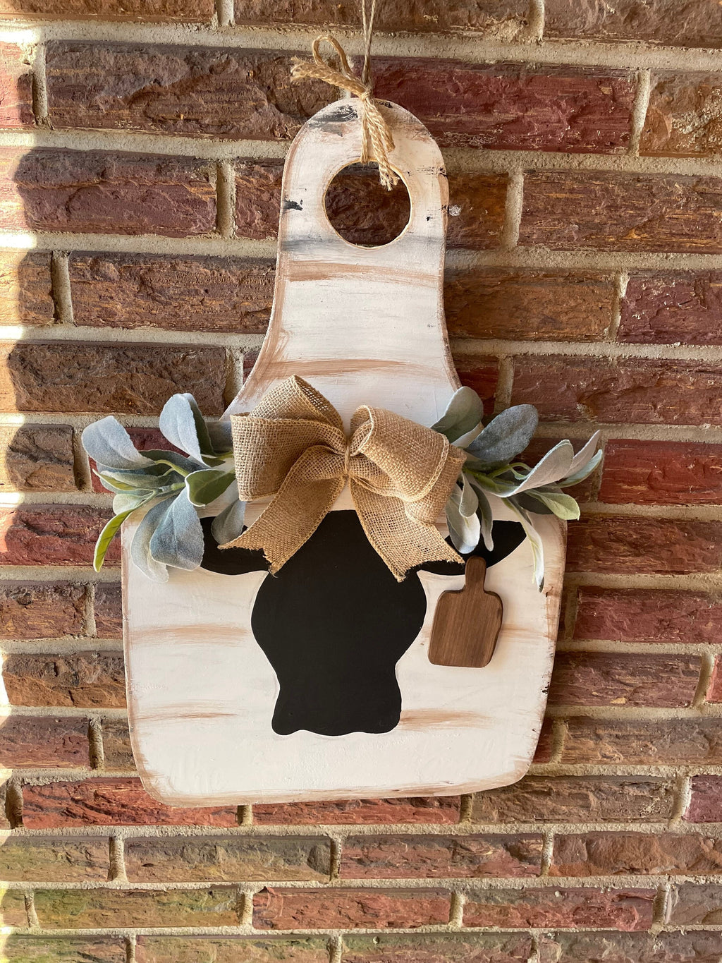 Cow door hanger with greenery