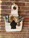 Cow door hanger with greenery