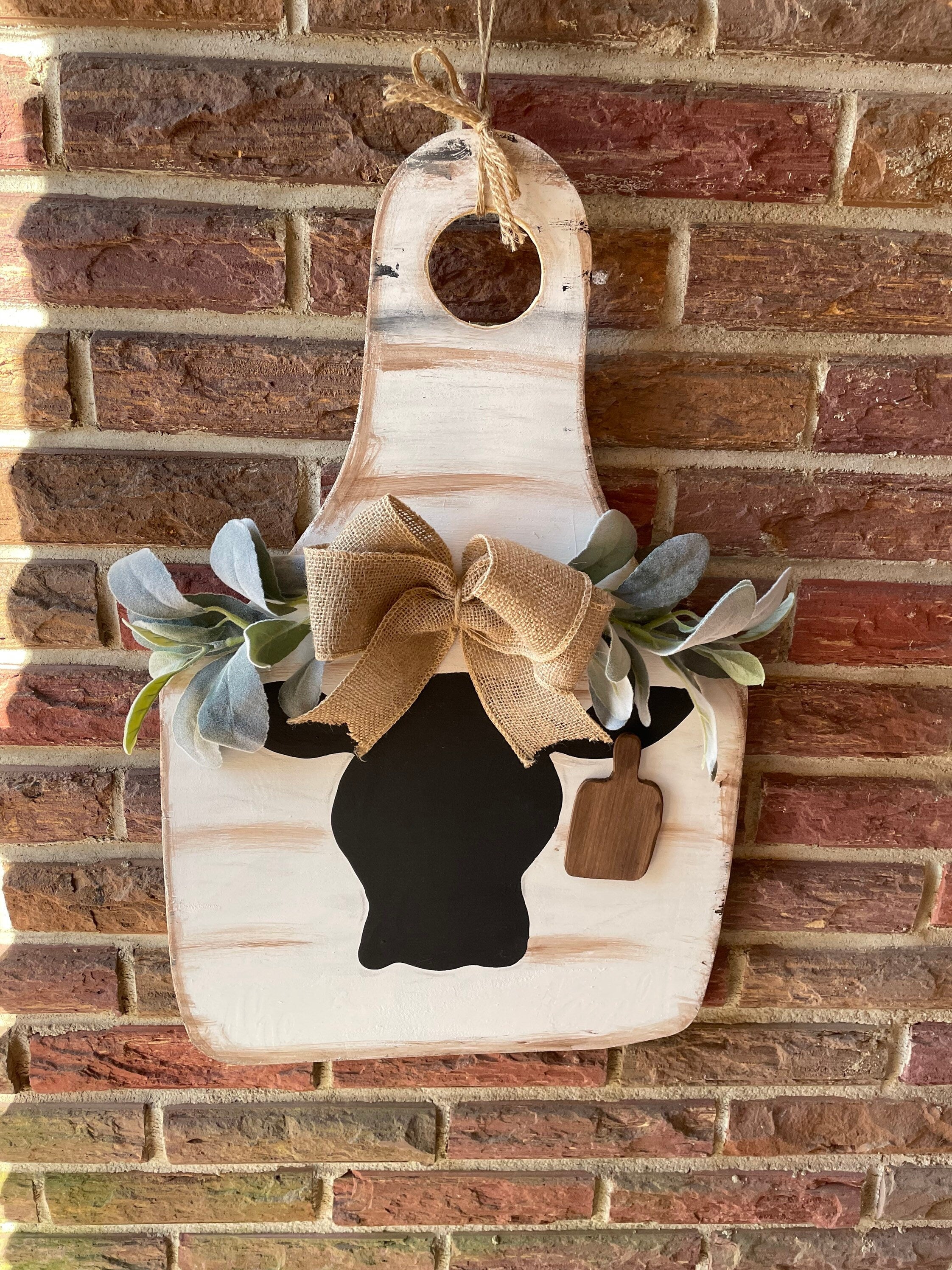 Cow door hanger with greenery