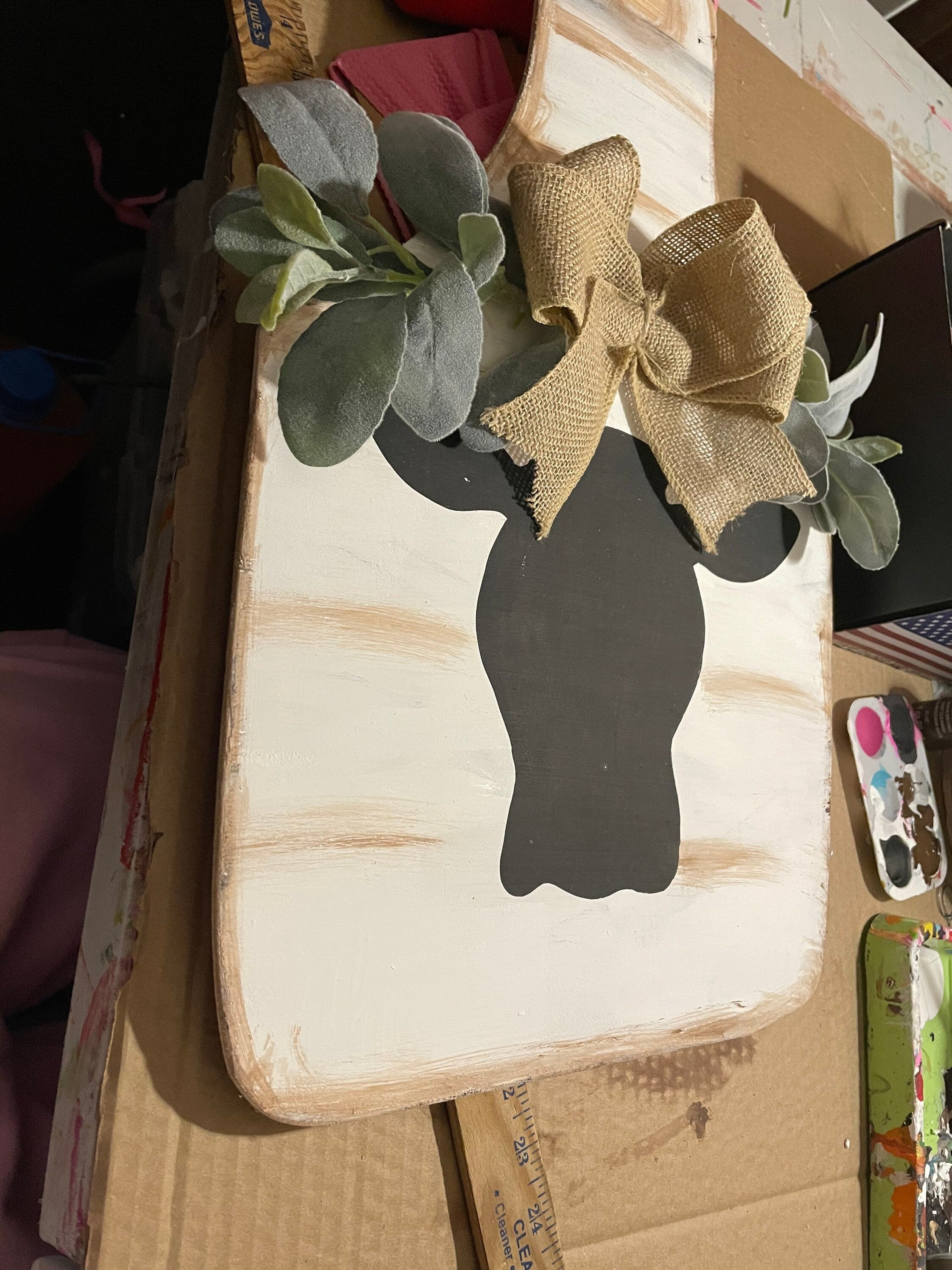 Cow door hanger with greenery